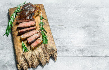 Grilled beef steak with rosemary and spices.