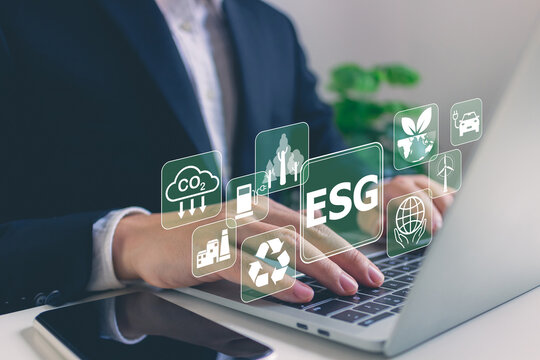 Businessman analyze investment sustainability ESG icons.ESG environmental protection concept, sustainable development, climate change, green energy recycle, Net zero and carbon neutral.