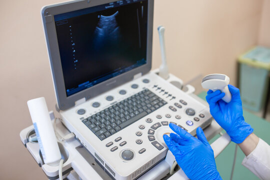 Ultrasound doctor in the clinic office conducts a study of the genitourinary system