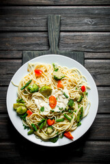 Pasta with Brussels sprouts,broccoli and tomatoes.