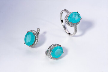 Elegant jewelry set. Jewellery set with gemstones. Jewelry accessories collage. Product still life concept. Ring, necklace and earrings.