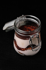 Classic Italian tiramisu dessert served in a jar