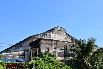 BANGKOK THAILAND - January 18, 2023 : Old abandoned buildings have been abandoned for a long time with blue sky background.