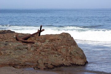 Fototapeta na wymiar rusty anchor on the beach