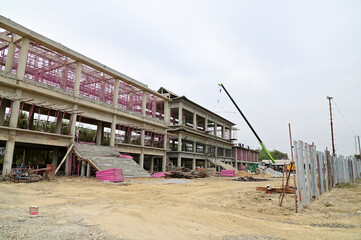 Obraz premium NONTHABURI, THAILAND - January 17, 2023 : The Building under construction new chinese style in the city. Construction Concept in Thailand.