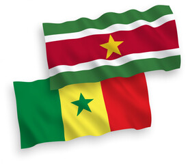 Flags of Republic of Senegal and Republic of Suriname on a white background