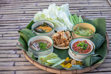Khantoke traditionally meal set with sticky rice popular local Thai food in North of Thailand