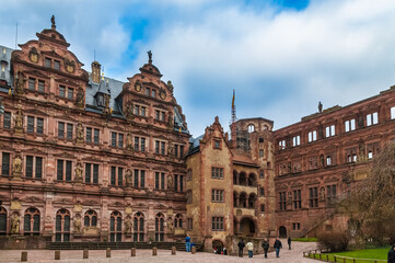 Fototapeta na wymiar The courtyard of the castle ruin Heidelberger Schloss, Germany. Between the Friedrich’s Wing and the Ottheinrich’s Wing stands the Hall of Glass with its stair tower which has a sundial on its facade.