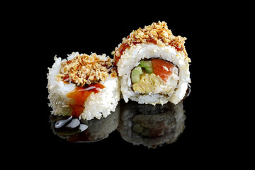 Sushi roll with smoked salmon, cucumber and cream cheese