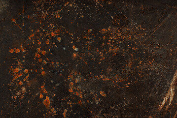 Dark abstract background with scuffs and scratches. Metal texture with rust