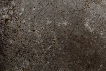 Dark abstract background with scuffs and scratches. Metal texture with rust