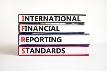 IFRS symbol. Concept words IFRS international financial reporting standards on books on beautiful white background. Business IFRS international financial reporting standards concept. Copy space.