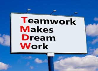 TMDW Teamwork makes dream work symbol. Concept words TMDW Teamwork makes dream work on big billboard against beautiful blue sky. Business TMWD teamwork makes dream work concept. Copy space.