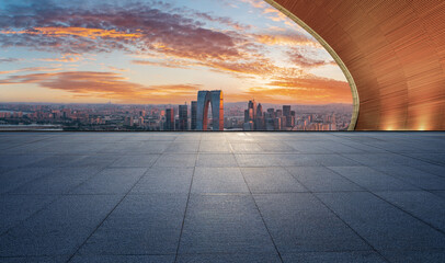 Empty floor and modern city skyline with building at sunset in Suzhou, China. high angle view.