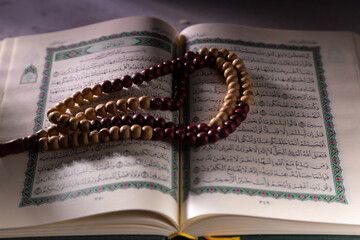  Concept: open Quran book  local language holy prayers for god,Coran - holy book of Muslims religion,
Friday month of 1444 Puasa Ramadan religion Islamic worshiping faith 
