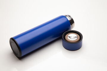 Aluminum blue bottle water placed on a wooden table in a restaurant or shop, Concept: Reduce plastic waste to recycle reusable and ecology nature, stainless glossy metal-containing liquid for sport