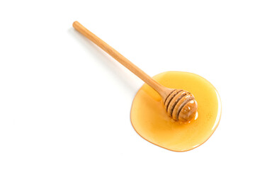 Honey with honey dipper on white background