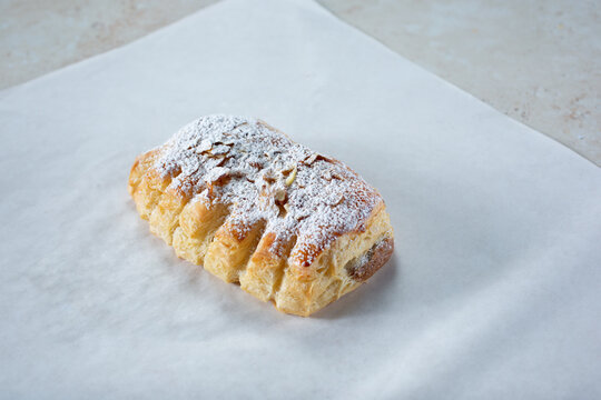 A view of an almond croissant bear claw pastry.