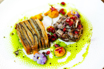 Shiitake and potatoes. Vegan. Shiitake mushroom, potato gratin, Beluga lentils, yellow beet cream. Delicious healthy traditional food closeup served for lunch in modern gourmet cuisine restaurant
