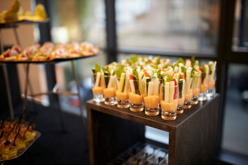 Vegetables cut into cubes in a glass with sauce. Catering 