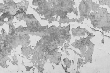 Black and white photograph of Old grunge wall with cracks and dampness. Close-up texture for design. Colored cracked background. Antique, old age, decay. Wallpaper, banner, graphic.