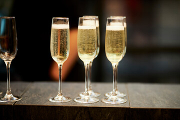 Glasses of champagne are on a black table. Vacation and party concept.