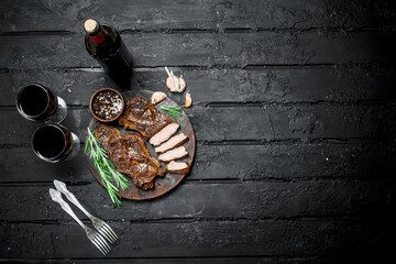 Grilled beef steak with red wine.