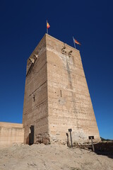 Biar, Alicante, Spain, January 14, 2023: Tower of the Arab Castle of Almohad origin from the 12th century in Biar, Alicante, Spain