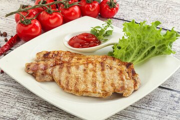 Grilled pork steak with ketchup