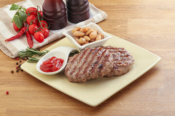 Grilled beef burger cutlet with sauce