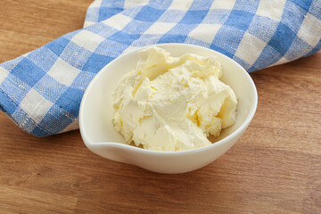 Italian soft mascarpone cheese in the bowl
