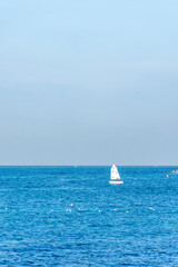 Sailing boat on the blue Mediterranean in Algiers city. Water sports.
