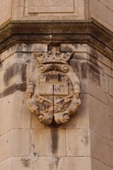 Biar, Alicante, Spain, January 14, 2023: Coat of arms on an exterior wall of the church of our Lady of the Assumption of Biar, Alicante, Spain