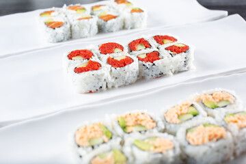 A view of several sushi rolls.