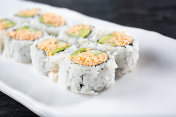 A closeup view of a spicy California roll.