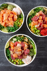 A top down view of three poke bowls. © DAVID
