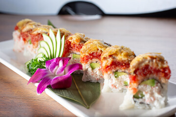 A closeup view of a sushi roll featuring ahi tuna, escolar, imitation crab meat and avocado. © DAVID