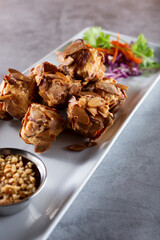A view of an appetizer plate of deep fried tofu.