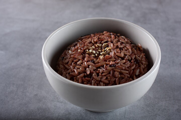 A view of a bowl of colored brown rice.