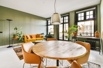 Spacious and bright living room with large windows and beautiful sofas