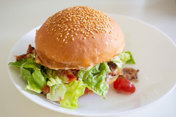 Home made beef hamburger with cheese and vegetables