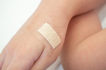 waterproof adhesive plaster on little kid hand