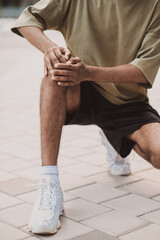 Adult athlete suffering from acute knee pain