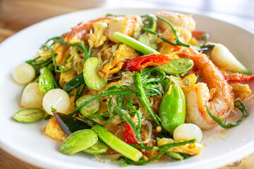 Stir Fried Glass Noodle with egg , prawn, Bitter bean, acacia pennata, Pickled garlic. Thai food
