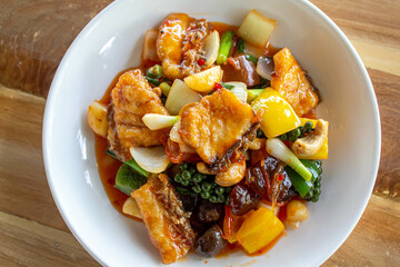 Top view, Deep fried snapper(sea bass) fillets stir fried with cashew nut, Jujube, Chestnuts, Ginkgo and Sweet pepper.