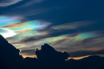 Beautiful iridescent cloud, Irisation. Skyscraper background.