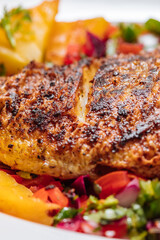 Red Snapper with ingredients. Prepared in tropical taste with Pico de Gallo and pineapple. Fresh and tasty fish and seafood. 