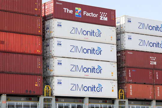 Shipping port of Haifa, Israel - October 25, 2021: ZIM Shipping Company logo on a shipping container.