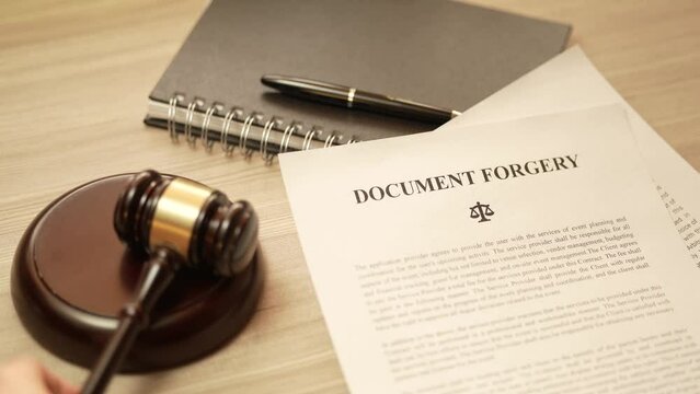 Document Forgery Legal Law Paper With Judge Gavel Closeup
