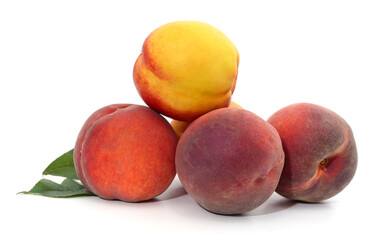 A bunch of peaches and leaves.